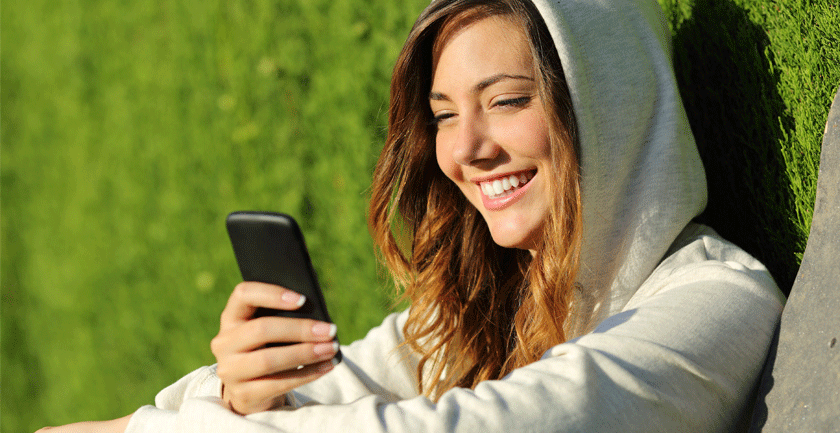 Girl-with-hoodie-on-mobile-phone