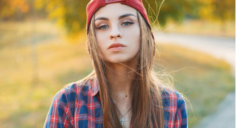 Teenage girl wearing baseball cap