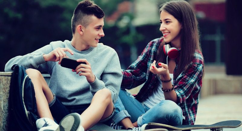 teenagers relaxing with mobile phones