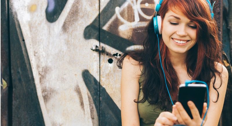 teenage girl surfing the net on smartphone