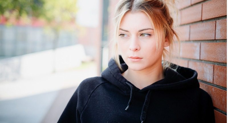 alone-and-sad-girl-portrait-next-urban-street-wall