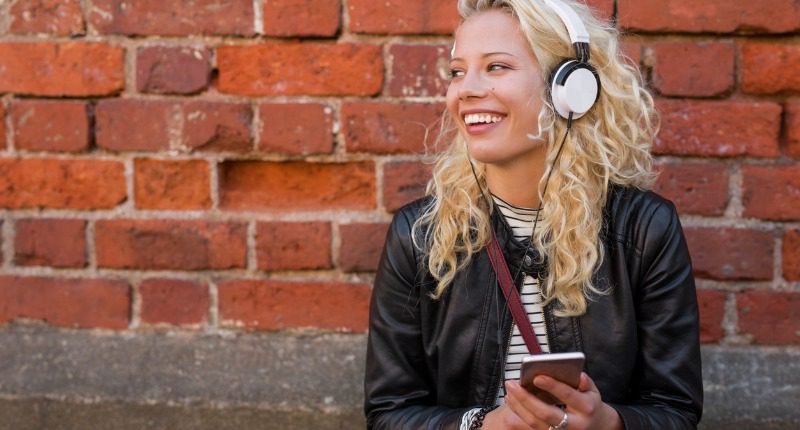 happy-girl-with-headphones-listening-to-music