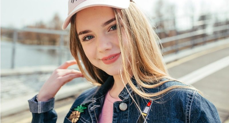 portrait-closeup-beautiful-young-girl-in-pink-hat-in-city-street