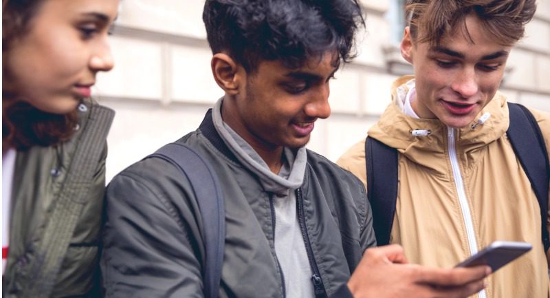 students-chatting-on-mobile-phone