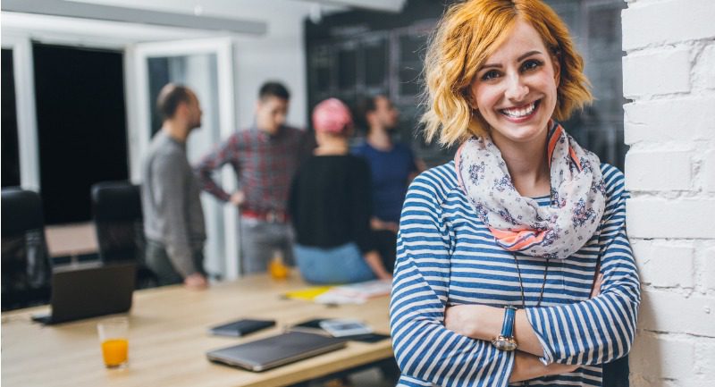 photo of young business woman in a conference room with ginger hair