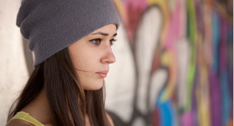 Teenage girl in a grey hat