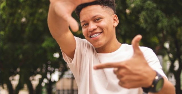 portrait-of-a-guy-doing-frame-with-fingers-looking-at-you-picture