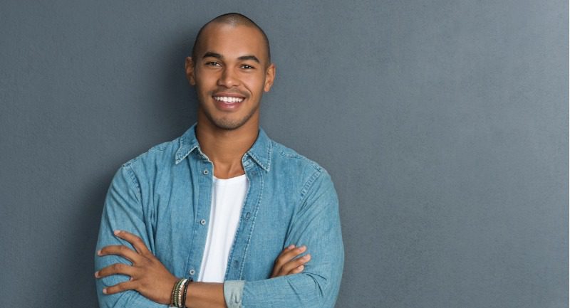 Man in a blue shirt and white t-shirt