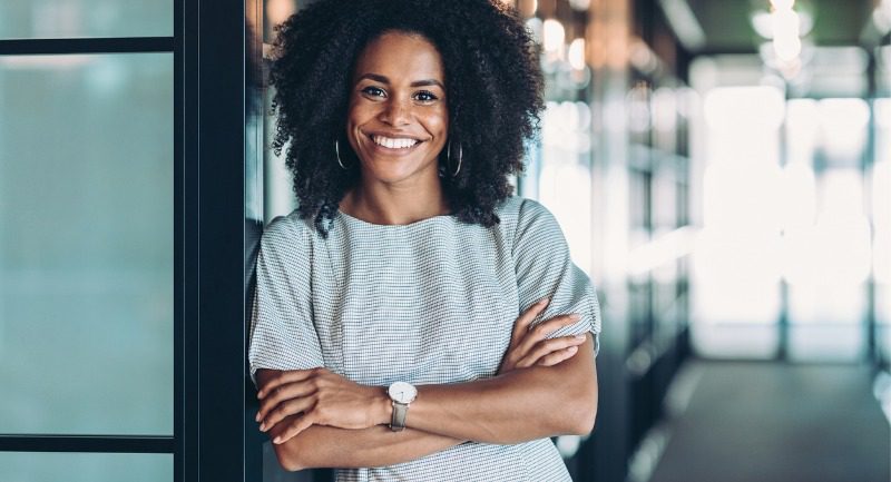 Young business woman smiling at the camera