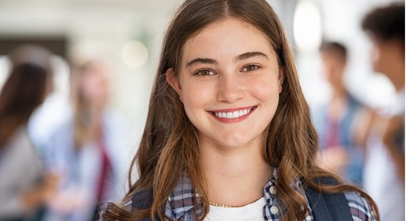 Teenage girl smiling at the camera