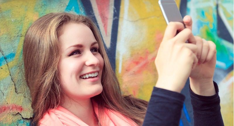 Girl taking a photo with her phone