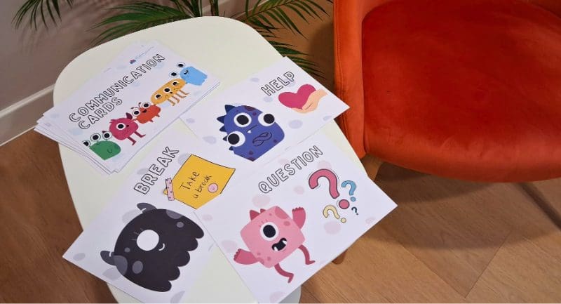 A collection of laminated cards each with a different cartoon monster on them