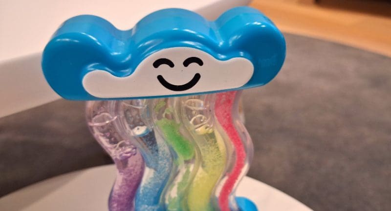 A rainbow themed fidget toy